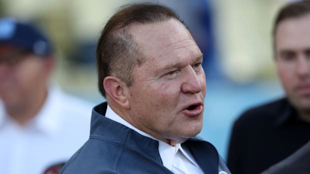 Agent Scott Boras watches a batting practice before Game 1 of the NLDS for the 2023 MLB playoffs between the Los Angeles Dodgers and the Arizona Diamondbacks.